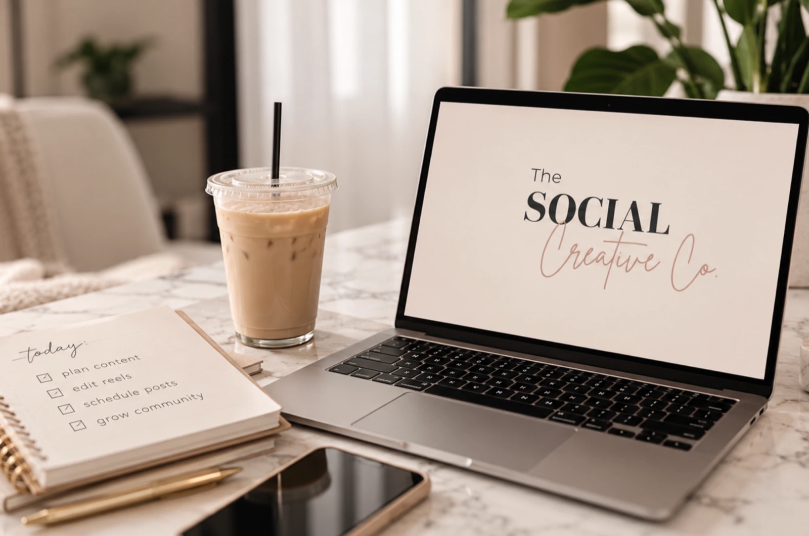 Laptop showing The Social Creative Co. logo beside an iced coffee and a to-do list: plan content, edit reels, schedule posts, grow community
